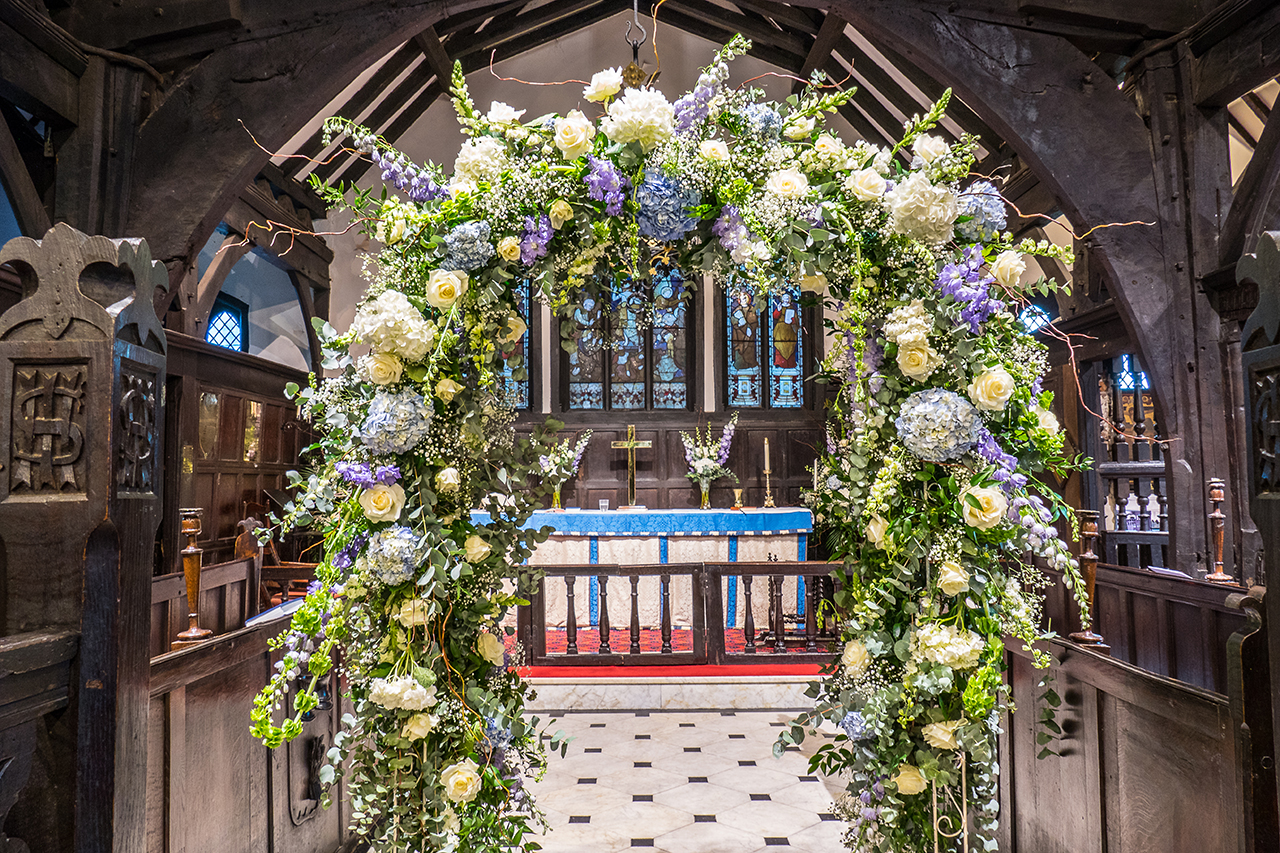 view of the altar with floral arch